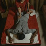 Relaxing Thai massage in a serene spa setting, enhancing wellness and relaxation.